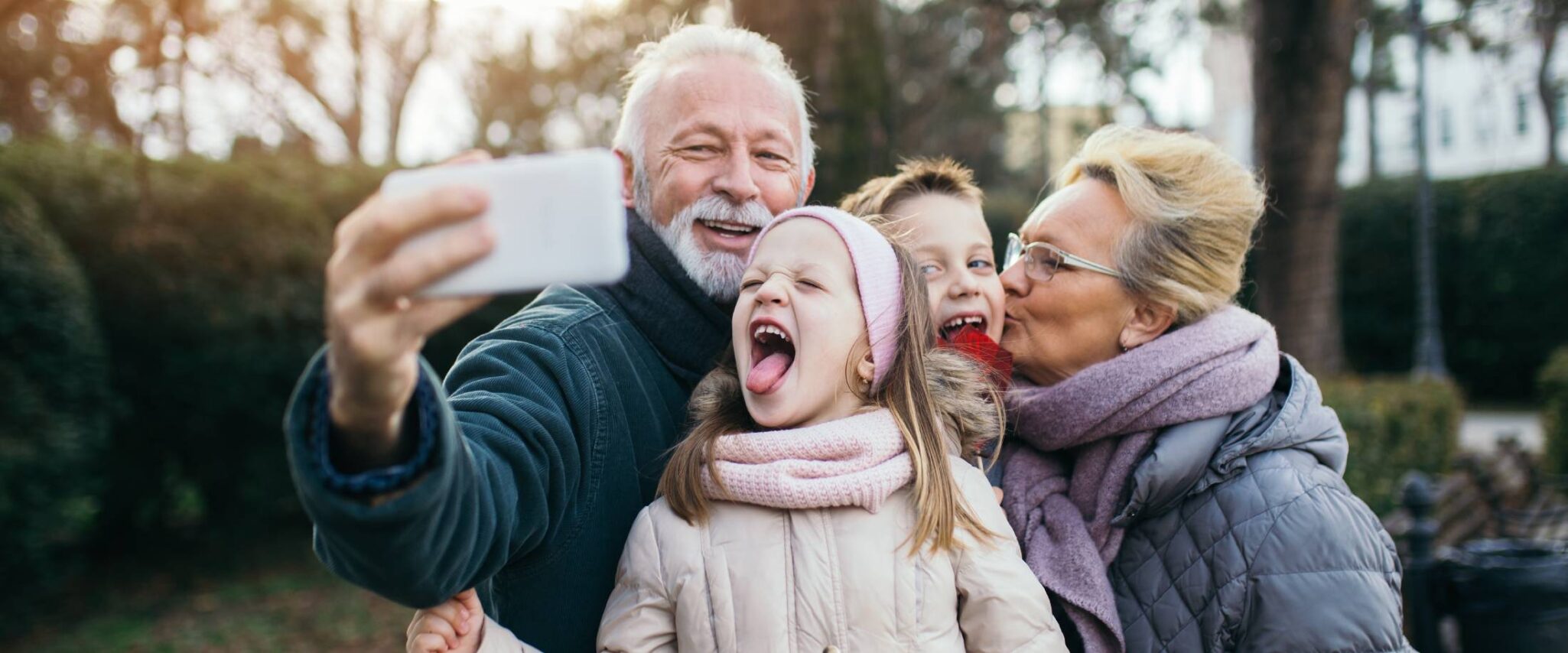 grandparents taking selfies with their grandchildren