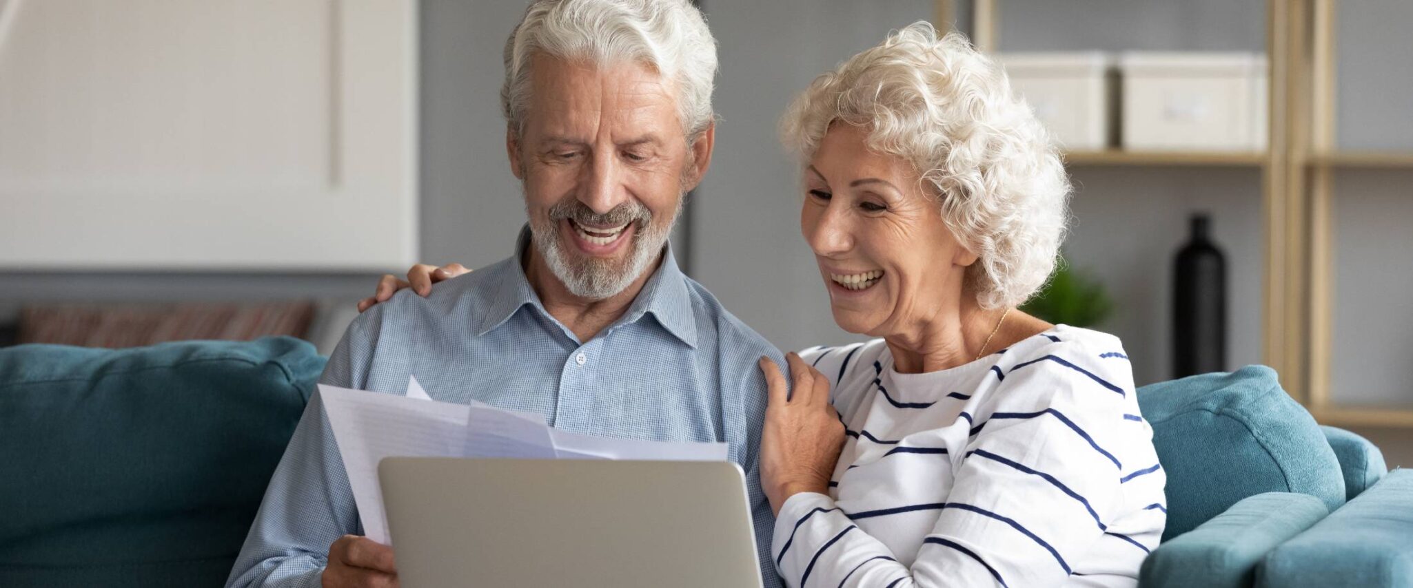 senior couple looking at a laptop together