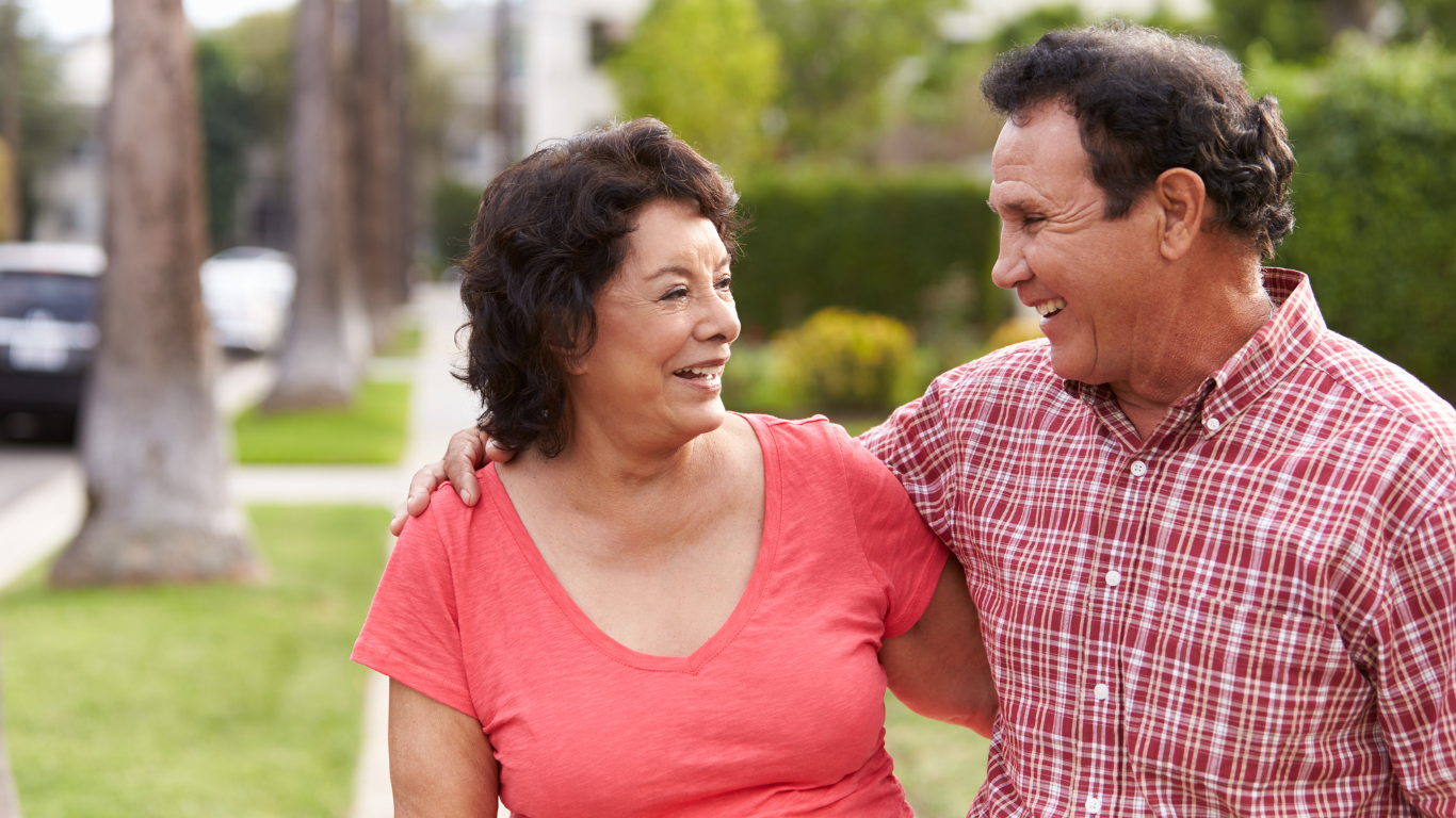 Smiling senior couple on outdoor walk
