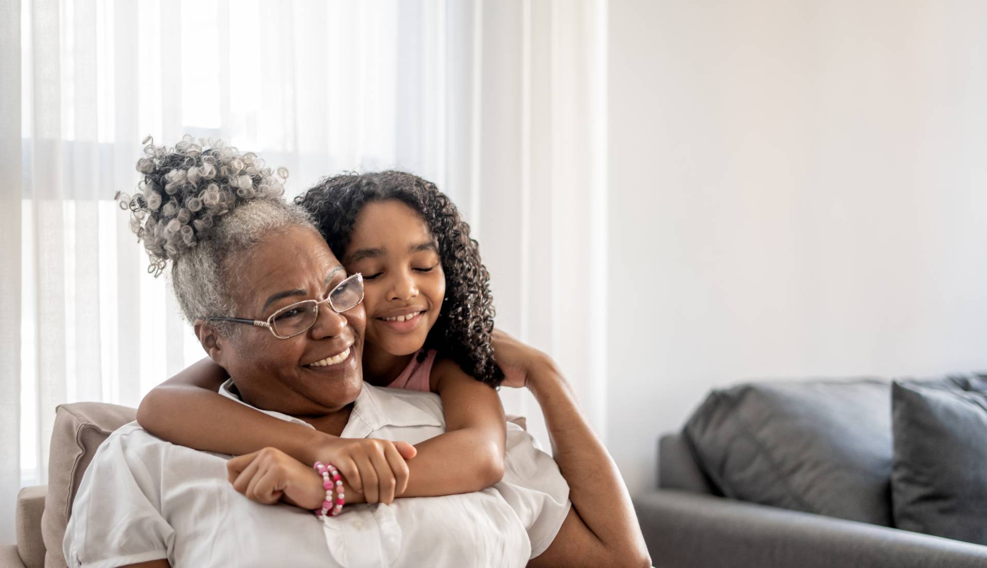 woman and her grandchild hugging