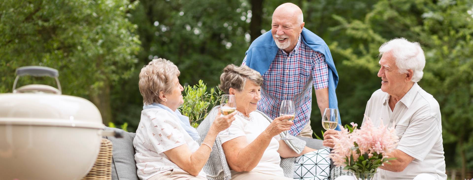 social seniors gathered for a happy hour outside
