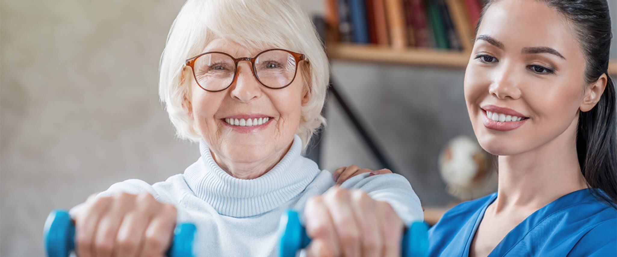 Elderly woman doing physical therapy with a physical therapist