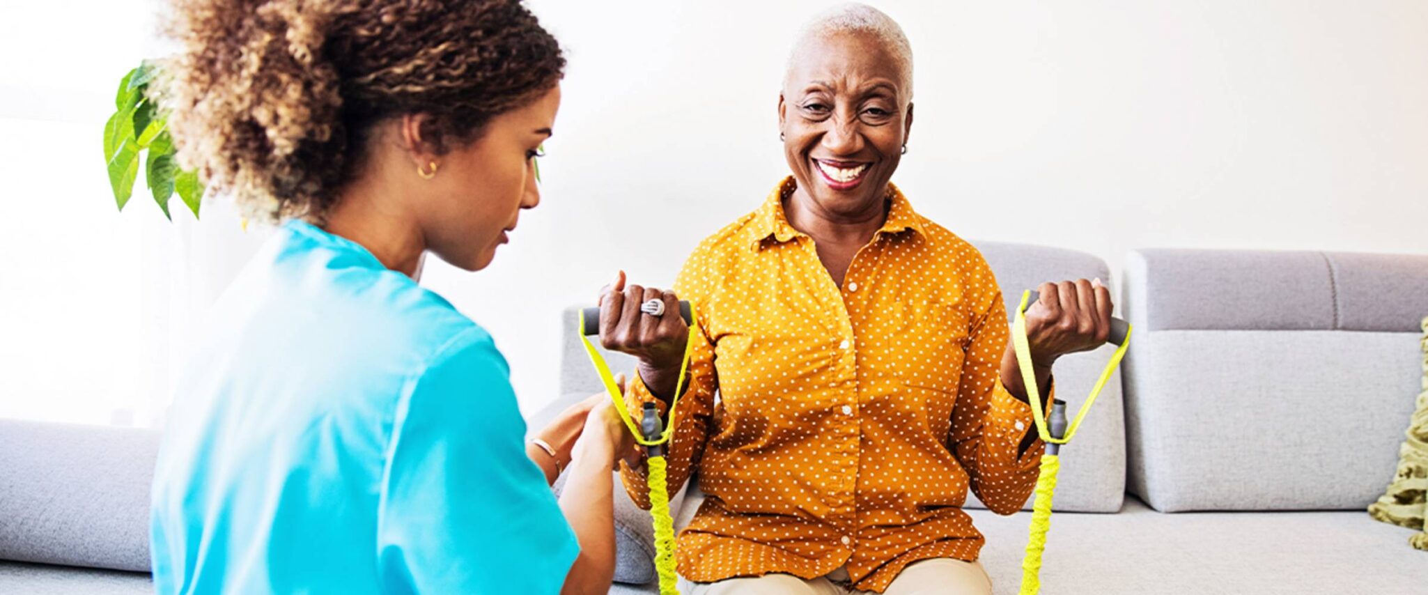 An occupational therapist meets with a senior woman