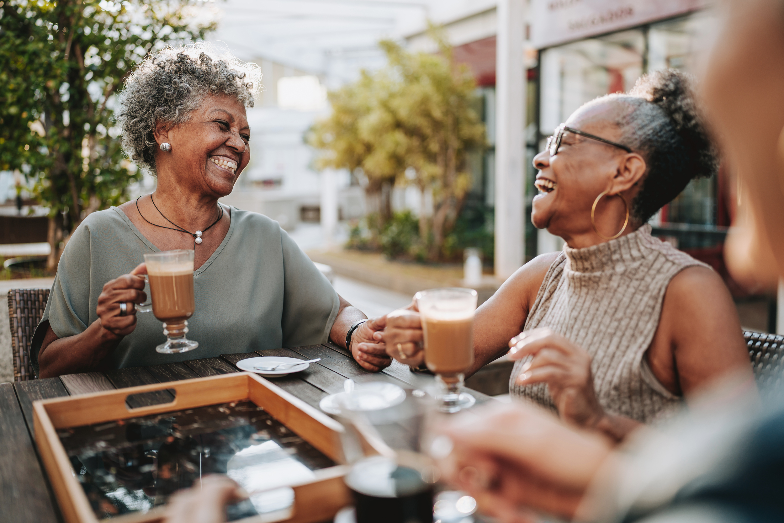 Group of seniors smiling at coffee shop