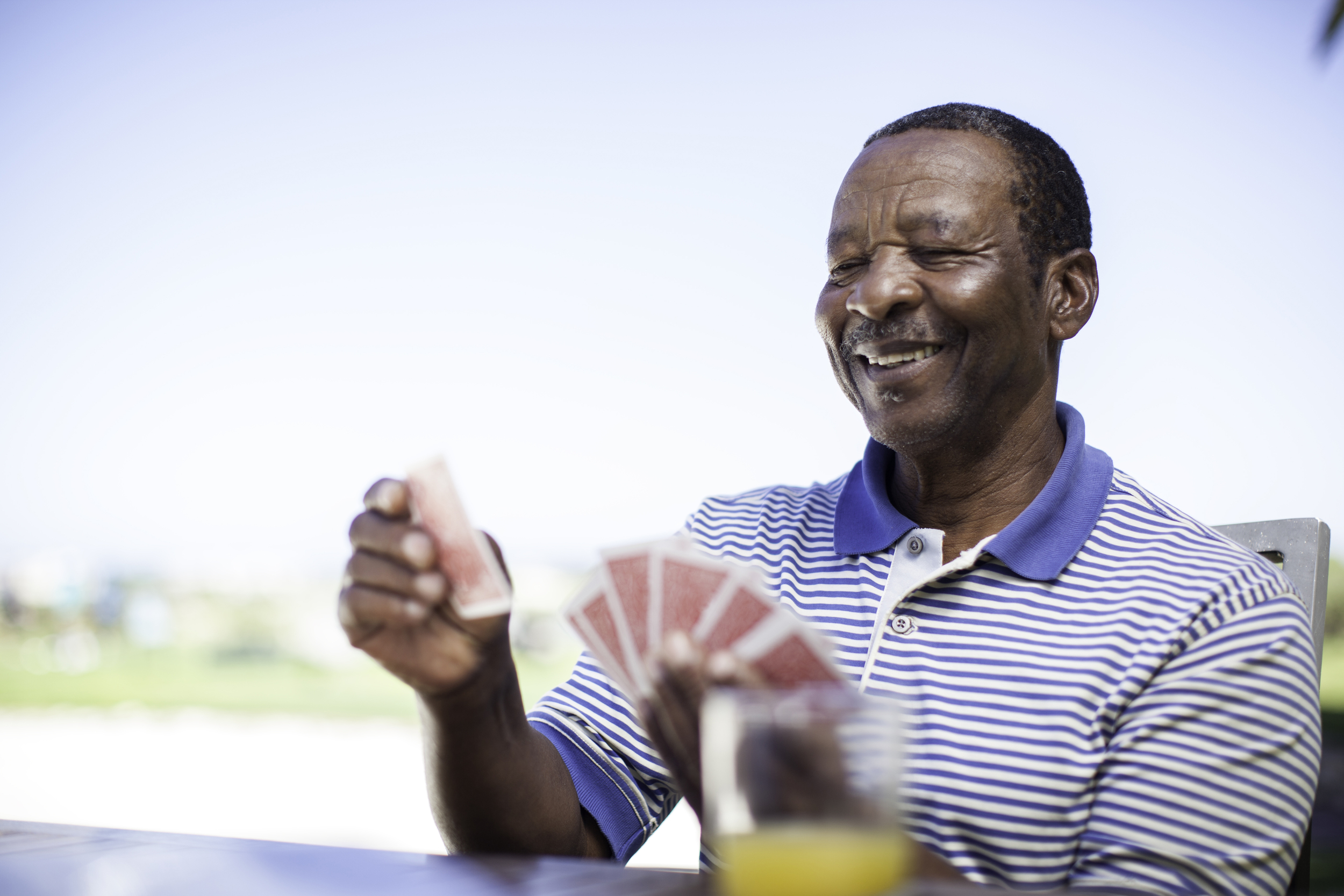Senior man playing a game of cards